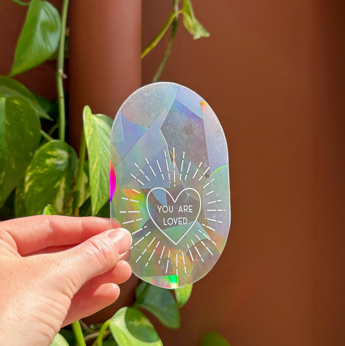 Regenboog sticker (you are loved)